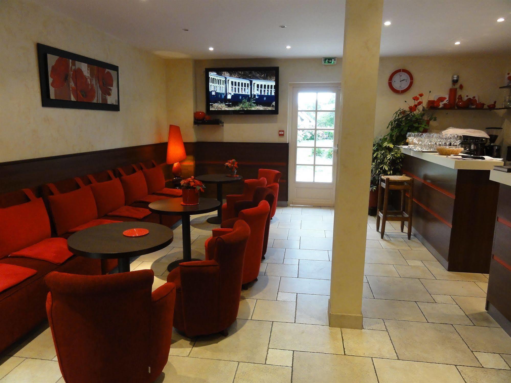 Hotel Restaurant Les Coquelicots, The Originals Relais 圣帕尔杜洛尔蒂日耶 餐厅 照片